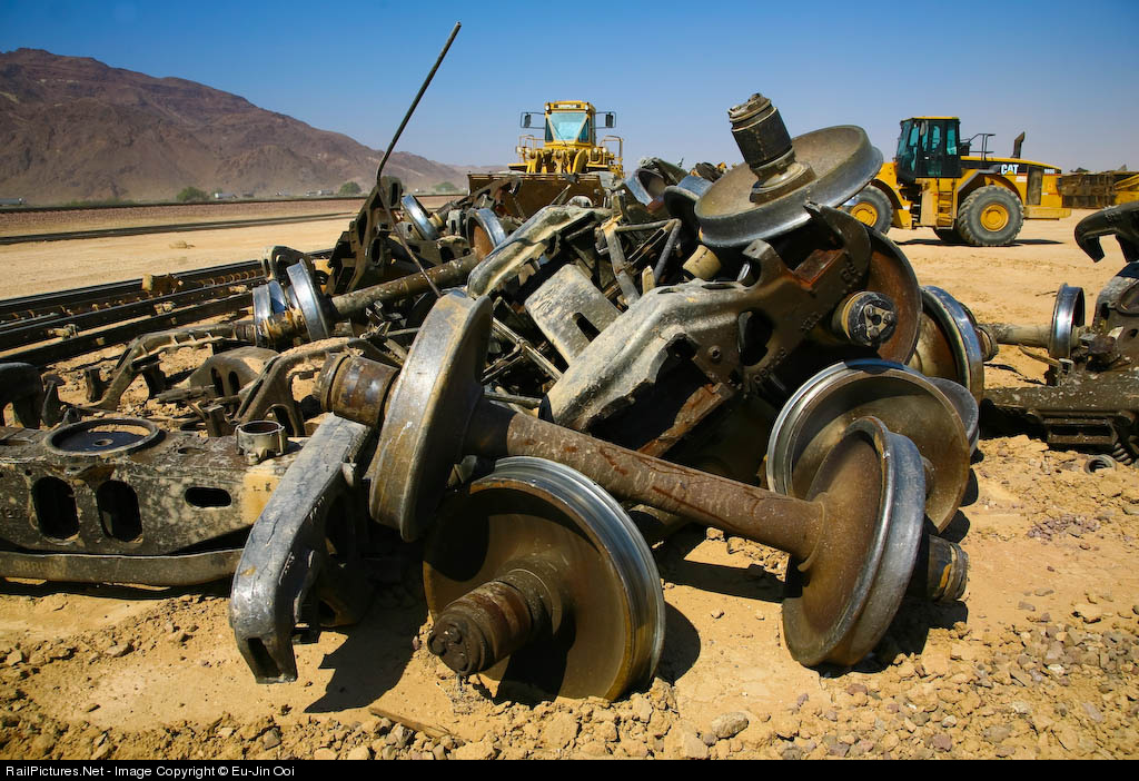 rail trucks piled up after a derailment